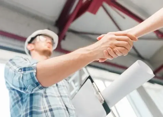 Builder shaking hands